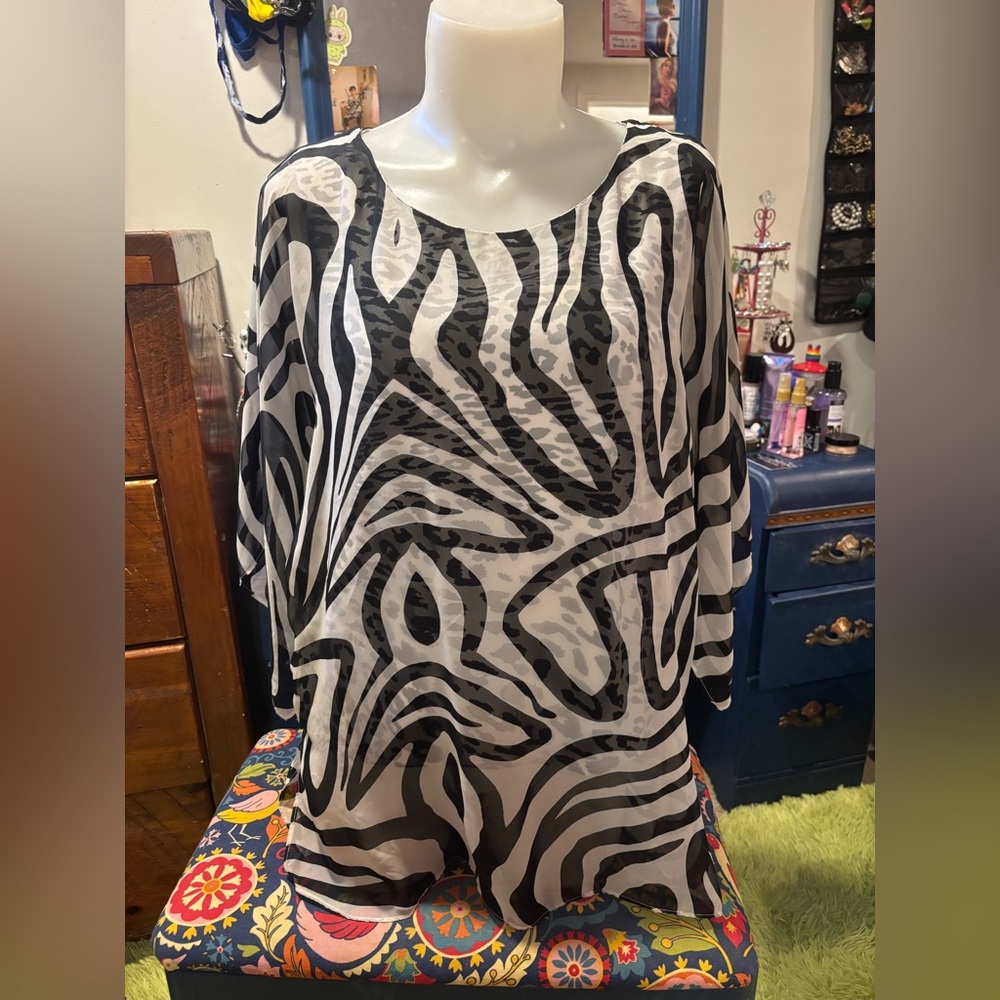Multi print tunic with wide kimono sleeves.
